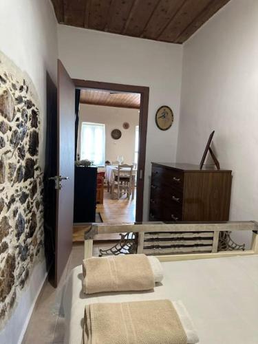 a room with a bed and a dining room at Dreamcatcher in Makrikhórion