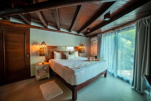 Cama o camas de una habitación en Ana y Jose Hotel & Beach Club Tulum