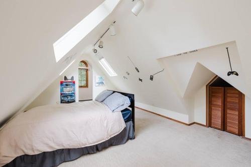 a bedroom with a bed in a attic at Private estate apartment. in Glen Head