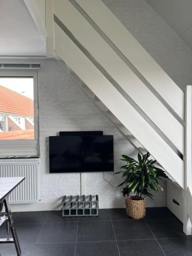 TV a/nebo společenská místnost v ubytování Appartement 228 Bruinisse