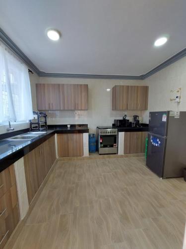 Η κουζίνα ή μικρή κουζίνα στο Greenwood Garden 3bedroom Mtwapa