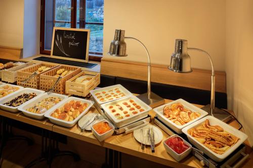 a buffet of different types of food on a table at Pivovar Rožmberk in Rožmberk nad Vltavou