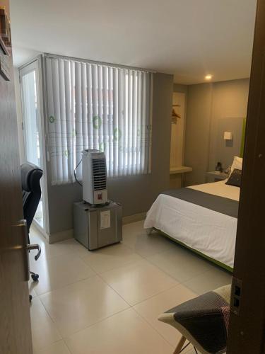 Postel nebo postele na pokoji v ubytování HOTEl DIBENI PEREIRA