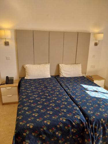 Postel nebo postele na pokoji v ubytování Whitestar Guesthouse