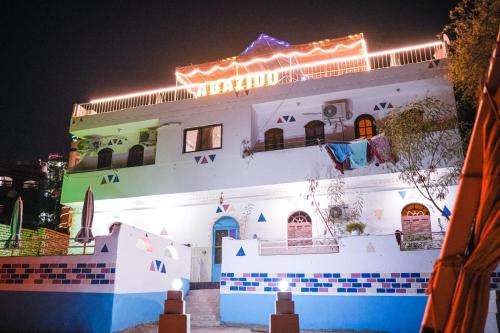 a building with lights on top of it at night at ABAZIDO Nubian Guest House in Aswan