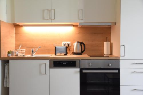Η κουζίνα ή μικρή κουζίνα στο Charming Homes - Studio 10