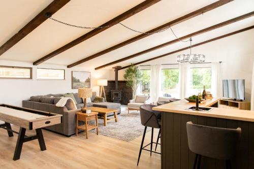 a living room with a couch and a table at Vineyards Edge - Pool, Hot Tub, Bikes- 1mi to Downtown in Healdsburg