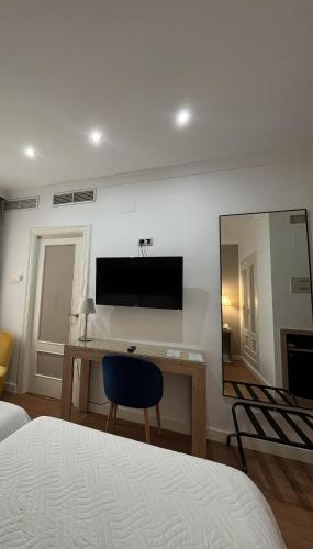 Μια τηλεόραση ή/και κέντρο ψυχαγωγίας στο Hotel Santo Domingo Lucena