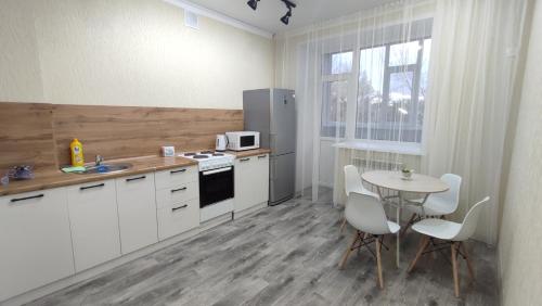 Η κουζίνα ή μικρή κουζίνα στο ЖК SHANYRAK, Люкс апартаменты 8кв, 2 этаж
