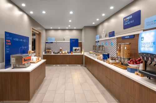 a grocery store with a checkout counter and a bakery at Holiday Inn Express & Suites - Hawaiian Gardens, an IHG Hotel in Hawaiian Gardens