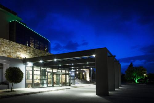a building at night with lights on at Domotel Xenia Volos in Volos