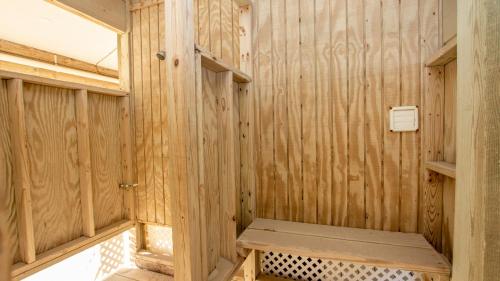 a wooden sauna with a bench in it at OCEANFRONT, Ocean views, Dogs Welcome! KH10, Beach House in Kitty Hawk