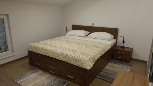 a bed with two pillows on it in a bedroom at Apartment in Crikvenica with sea view, balcony, air conditioning, WiFi 4973-1 in Crikvenica