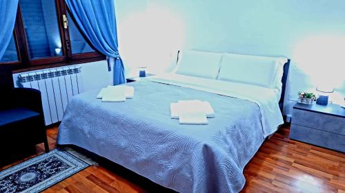 a bedroom with a bed with two towels on it at Venice Suites in Mestre