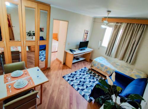 a living room with a couch and a table at Residencial Bella Vista Suites in Sao Paulo