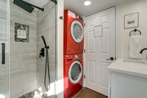a red washer and dryer in a bathroom at Lovely Redmond Home about 17 Mi to Downtown Seattle! in Redmond