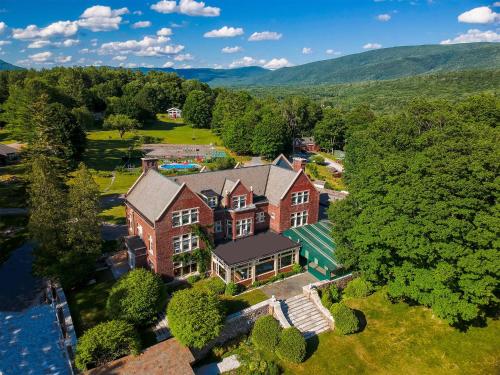 an aerial view of a large brick house at Wilburton Inn in Manchester