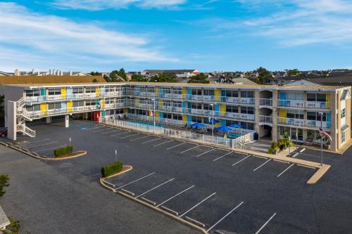 an aerial view of a hotel with a parking lot at Beach House Dewey in Dewey Beach