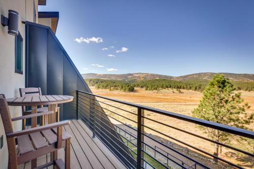 a balcony with a bench and a view of the mountains at Angel Fire Home with Hot Tub Less Than 1 Mi to Ski Slopes! in Angel Fire
