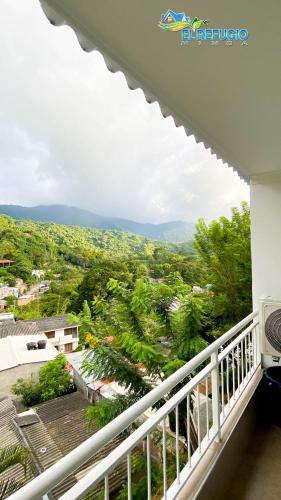 a view from the balcony of a house at El Refugio Minca in Minca