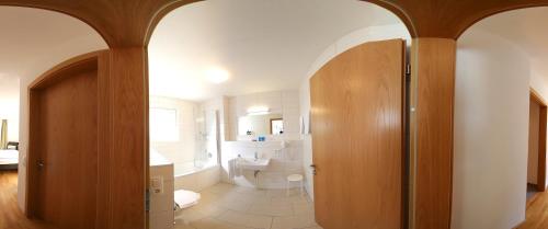 a bathroom with a toilet and a sink at Apart Mountain Lodge Mayrhofen in Mayrhofen
