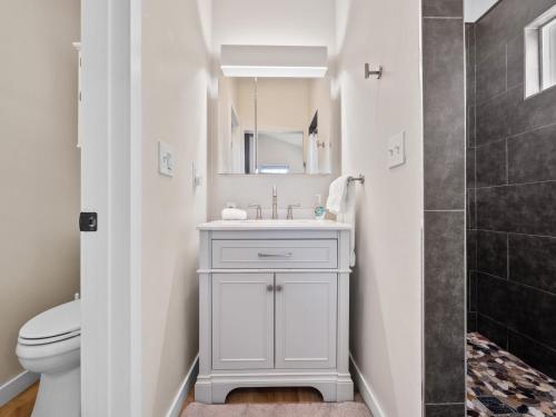 a bathroom with a sink and a toilet at A4609b- Sunset Cliffs Dream Apartment in San Diego
