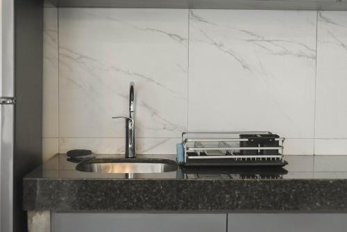 a kitchen with a sink and a counter top at CASA LUMBA in Guadalajara
