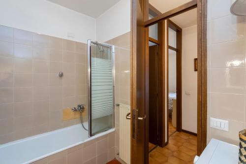 a bathroom with a shower and a mirror at [IHost Flat] - Valmalenco Marconi 33 in Chiesa in Valmalenco