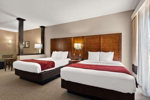 a hotel room with two beds and a desk at Comfort Suites Kanab National Park Area in Kanab