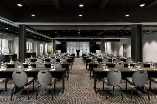 a large room with tables and chairs in it at Hilton Boston Park Plaza in Boston