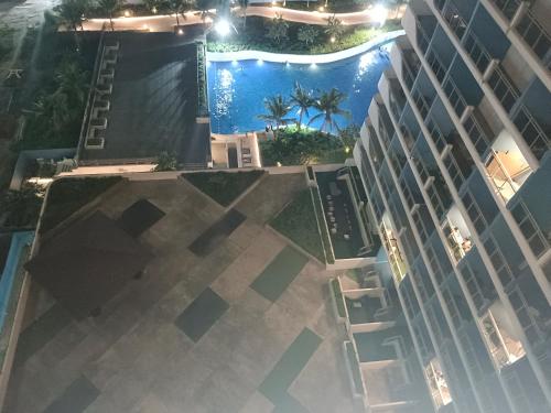an overhead view of a building with a swimming pool at BALI TOWER AZURE NORTH RESIDENCES in Lagundi
