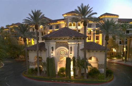 a large house with palm trees in front of it at Green Valley Ranch Resort Spa Casino in Las Vegas