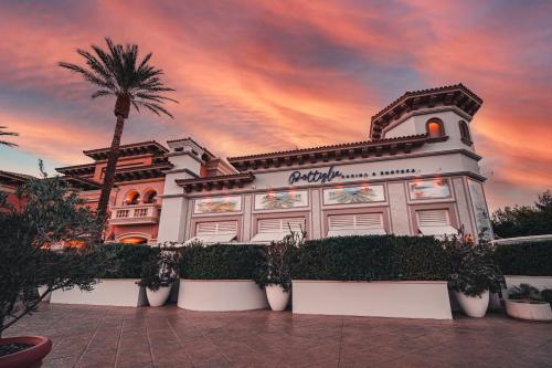 a building with a palm tree in front of it at Green Valley Ranch Resort Spa Casino in Las Vegas