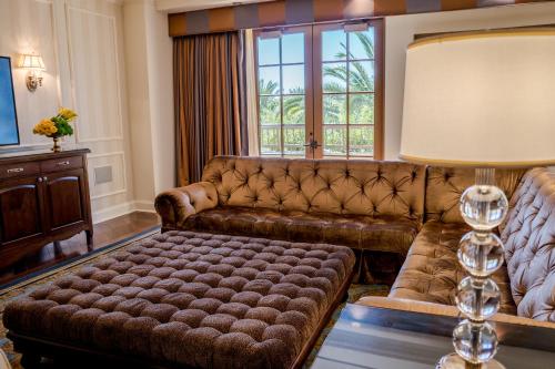 a living room with a couch and a window at Green Valley Ranch Resort Spa Casino in Las Vegas