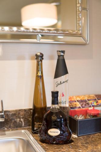 two bottles of wine sitting next to a sink at Green Valley Ranch Resort Spa Casino in Las Vegas