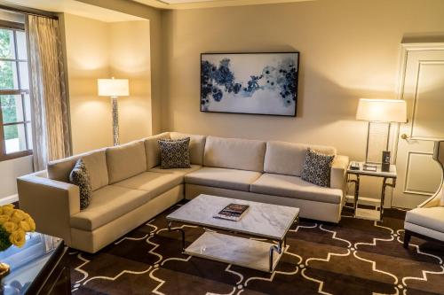 a living room with a couch and a table at Green Valley Ranch Resort Spa Casino in Las Vegas