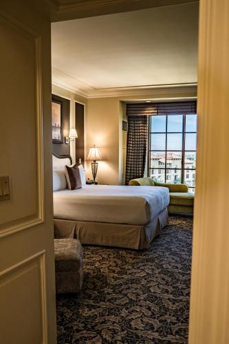 a hotel room with a large bed and a window at Green Valley Ranch Resort Spa Casino in Las Vegas