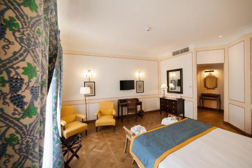 Ein Bett oder Betten in einem Zimmer der Unterkunft Algilà Ortigia Charme Hotel