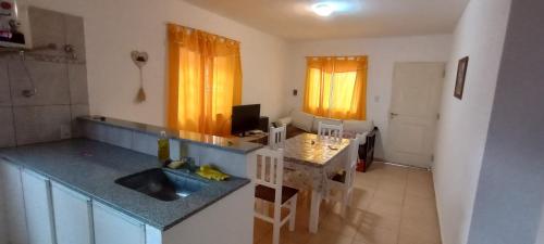 a kitchen with a sink and a counter top at Departamento Estrada in Santa Rosa