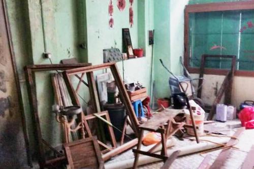 a room with paintings and other items on the floor at LEJU 21 樂居 Explore Malacca from a riverside house in Melaka