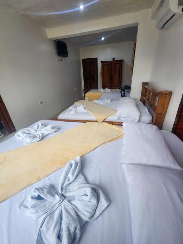Cama o camas de una habitación en Hostal Poseidon