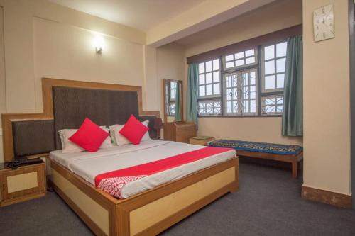 Postel nebo postele na pokoji v ubytování Goroomgo Hotel Shree Kolkata