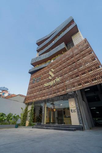 a building with a sign on the front of it at Stay.vie Hotel in Surabaya
