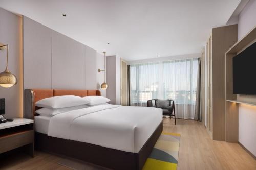 Postel nebo postele na pokoji v ubytování Home2 Suites by Hilton Beijing West Station