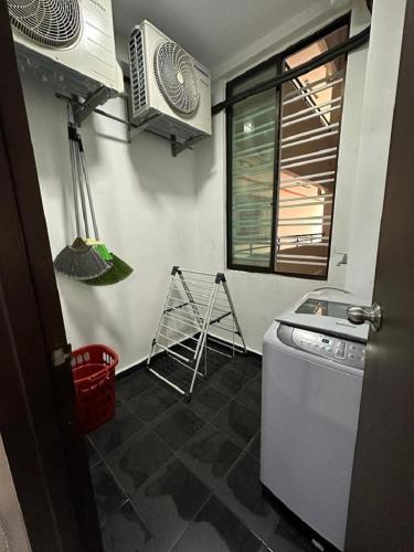 a kitchen with a sink and a stove and a window at Kyra The Heights Residence Condo Ayer Keroh Melaka WiFi, Netflix & Pool in Ayer Keroh