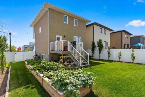 a house with a vegetable garden in a yard at Entire house to yourselves - NO basement sharing in Regina