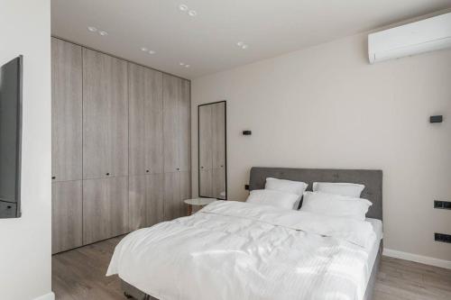 Posteľ alebo postele v izbe v ubytovaní Noviy Bereg Design Apartment