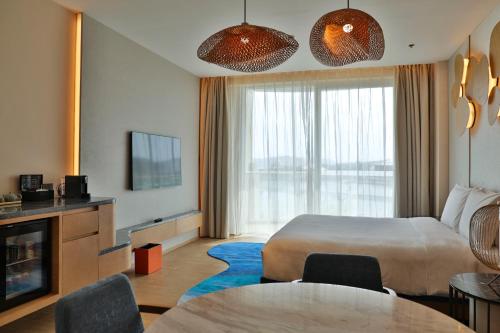 TV a/nebo společenská místnost v ubytování Hyatt Regency Hainan Ocean Paradise Resort