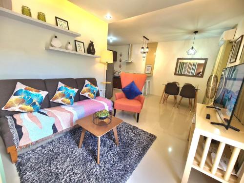 a living room with a couch and a table at Fully Furnished Apartment with Netflix and Wifi in Batangas City