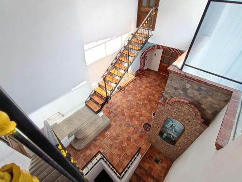 an overhead view of a living room with a spiral staircase at Casa Ángeles de Paxtitlàn in Guanajuato